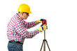 © POL Nefer - Builder man with   laser level side view. measuring  with  laser level. Construction Worker Handyman on  isolated background