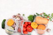 © Светлана Балынь - Healthy natural food in eco bag, healthy lifestyle concept, zero waste. Food delivery, donation, coronavirus quarantine. Vegetables, fruits and greens in tissue packaging, vegetarian diet,