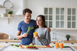© BestForYou - Young couple in the kitchen while preparing a vegetarian breakfast. Healthy eating