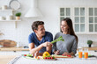 © BestForYou - Young couple in the kitchen while preparing a vegetarian breakfast. Healthy eating