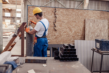 Wall Mural - Male worker using gas cylinder in workshop