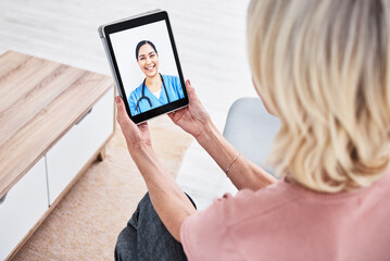 Canvas Print - Medical advice is just a tap away. Shot of a woman on a video call with a medical practitioner.