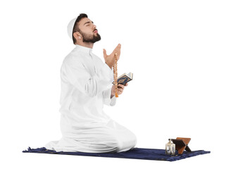 Wall Mural - Praying young Muslim man on white background