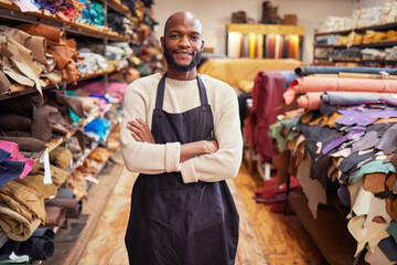 Canvas Print - Lifes about not taking failures personally. Shot of a young man working at his job in a shop.