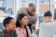 © Kay Abrahams/peopleimages.com - A supportive environment makes for a better working atmosphere. Shot of a group of businesspeople discussing something on a desktop.