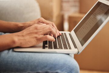 Poster - Looking for the perfect place to call home. Shot of an unrecognizable person using a laptop at home.