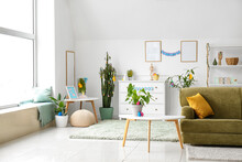 Interior Of Light Living Room With Green Sofa And Easter Eggs