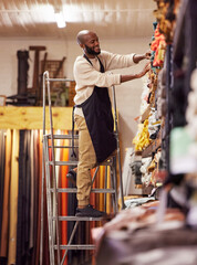 Aufkleber - Focus on doing what you do best. Shot of a young man working at his job in a shop.