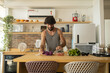© Buonaventura - Happy and healthy young man meal prepping whole vegetarian meal in the kitchen. High quality photo