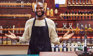 Aufkleber - Focus on building your business, be the one left standing. Shot of a young man working at his job in a shop.
