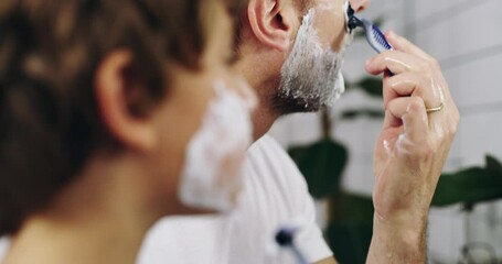 Sticker - Self care starts at home. 4k video footage of a father and his adorable son shaving together at home.