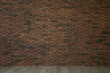 © New Africa - Empty room with red brick wall and wooden floor