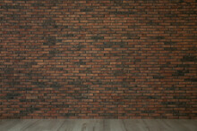 Empty Room With Red Brick Wall And Wooden Floor