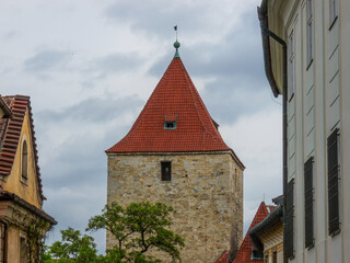 Poster - The Black Tower under a cloudy sky in the daylight in Prague, the Czech Republic