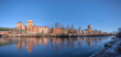 Panorama view with the bridge St Eriksbron over the canal Karlbergskanalen with ice floes, apartment houses and offices and the traffic route Karlbergsleden a sunny winter day in Stockholm