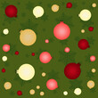 Seamless background of bright Christmas balls in red and yellow tones on a green background with snowflakes