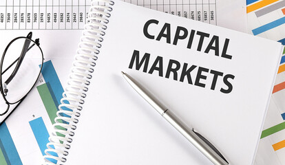 Poster - Notebook with text CAPITAL MARKETS . Diagram and white background,Business
