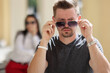 © H_Ko - Middle aged stylish male wearing sunglasses, handsome person posing for picture