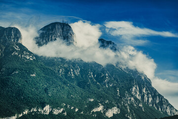 Wall Mural - Scenic view of mountains under cloudy sky