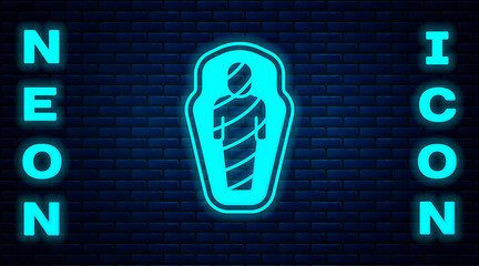 Sticker - Glowing neon Egypt mummy in sarcophagus icon isolated on brick wall background. Vector