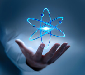 business man hand showing symbol of an atom nucleus with electrons - 3d illustration