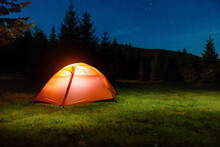 Illuminated Tent In Night Forest