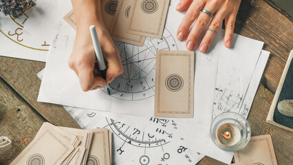astrology. astrologer calculates natal chart and makes a forecast of fate.tarot cards, fortune telli
