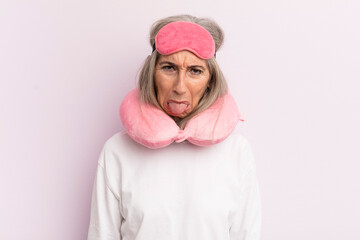 Wall Mural - middle age woman feeling disgusted and irritated and tongue out. flight passenger concept