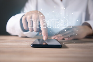 woman holding phone with digital text in screen