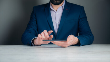 Wall Mural - Male hands holding and using tablet computer