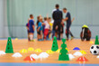 Futsal Soccer Training Court. Kids in a Group With Coaches in Blurred Background. Kids on Physical Education Class at School