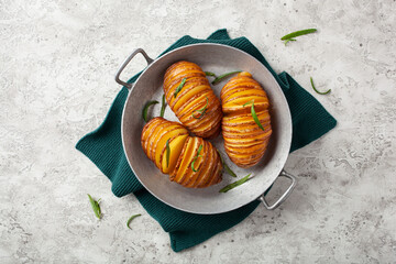 Wall Mural - baked hasselback potato with cheddar cheese and rosemary