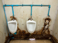The Dirty Urinal Row Of The Temporary Toilet In The Railway Station.