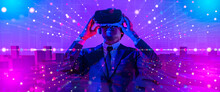Digital Community,Cryptocurrency And Entertainment Metaverse Concept.male Having Fun Play Game VR Virtual Reality Goggle In 3D Cyberspace Futuristic Metaverse NFT And Virtual Reality City Background