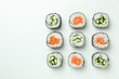 Concept of tasty food with sushi rolls on white background
