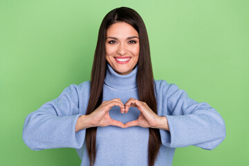 Wall Mural - Photo of sweet mature brunette lady show love wear blue sweater isolated on green color background