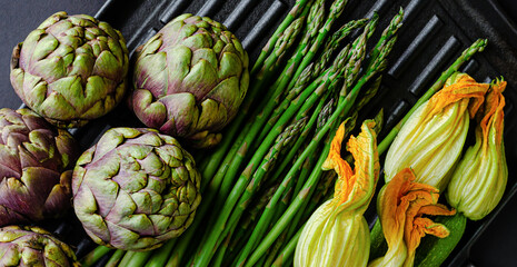 Wall Mural - Vegetarian food concept. Fresh green vegetables on dark background. Overhead