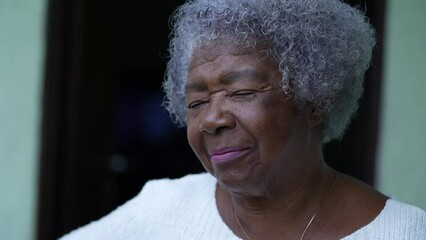 Poster - An African senior woman laughing and smiling portrait face