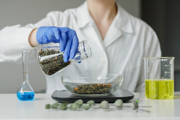 Woman scientist manufacturing natural organic healthy cosmetics in laboratory.