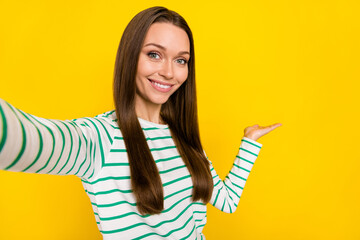 Poster - Photo of funny sweet lady dressed striped shirt recording video inviting empty space isolated yellow color background