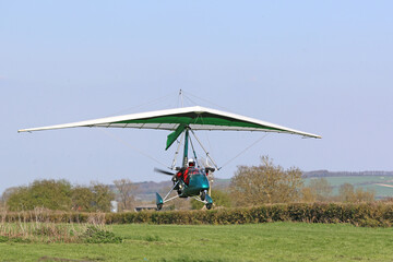 Poster - Ultralight airplane taking off from a farm strip	