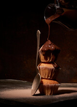 Chocolate Pouring On Baked Muffins