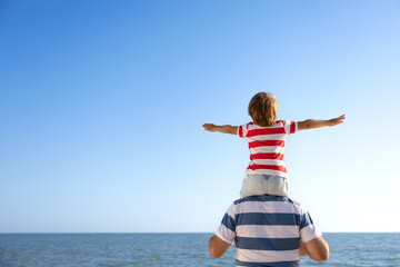 Wall Mural - Happy family having fun on summer vacation