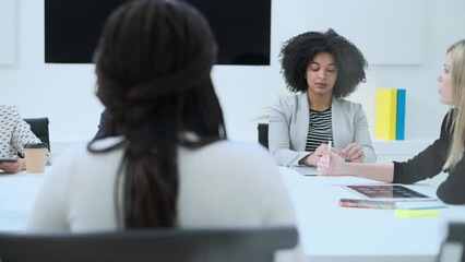 Wall Mural - Video of business people discussing together in conference room during meeting at office in a modern startup.