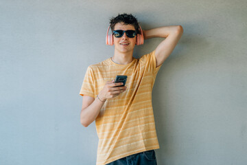 Sticker - young man with headphones and mobile phone