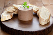 Home-made pate with herb and white bread slices