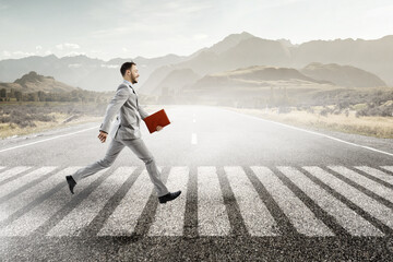 Wall Mural - Young businessman walking towards success