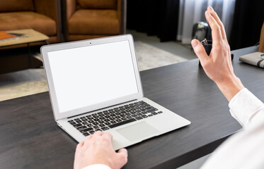 Poster - Laptop mockup. Online video call. Businessman waving hand to webcam. Online communication concept. High quality photo