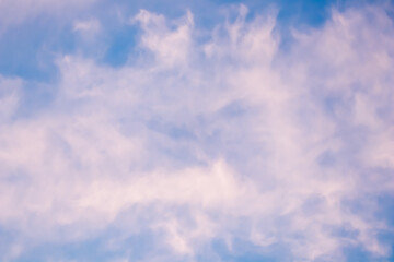 Wall Mural - Background of a beautiful pink and pale purple sky with clouds at sunset