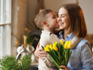 Poster - Young  woman mother with flower bouquet embracing son while getting congratulations on Mother's day